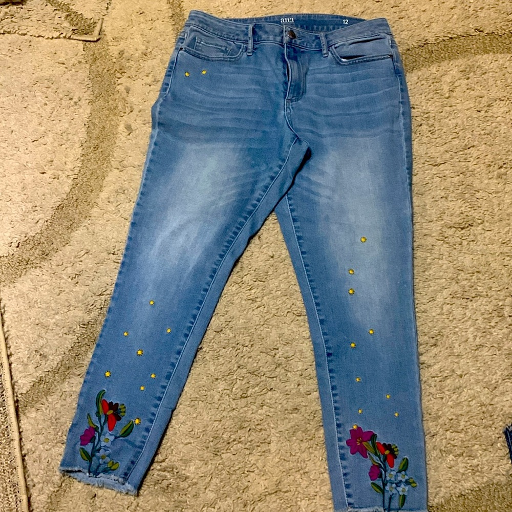A pair of jeans with flower decorations on both legs.  Great jeans. Brand ANA